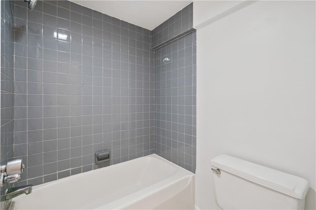 675 College Street, Unit A Pittsburgh, PA 15232 - Photo 26 of 28 a bathroom with a sink and bathtub
