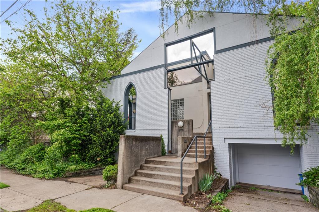 675 College Street, Unit A Pittsburgh, PA 15232 - Photo 28 of 28 a front view of a house with a tree