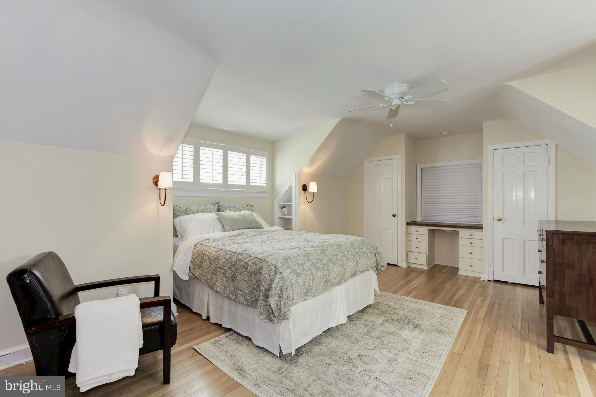 5608 Pollard Road Bethesda, MD 20816 - Photo 13 of 18 a bedroom with a bed and a chair