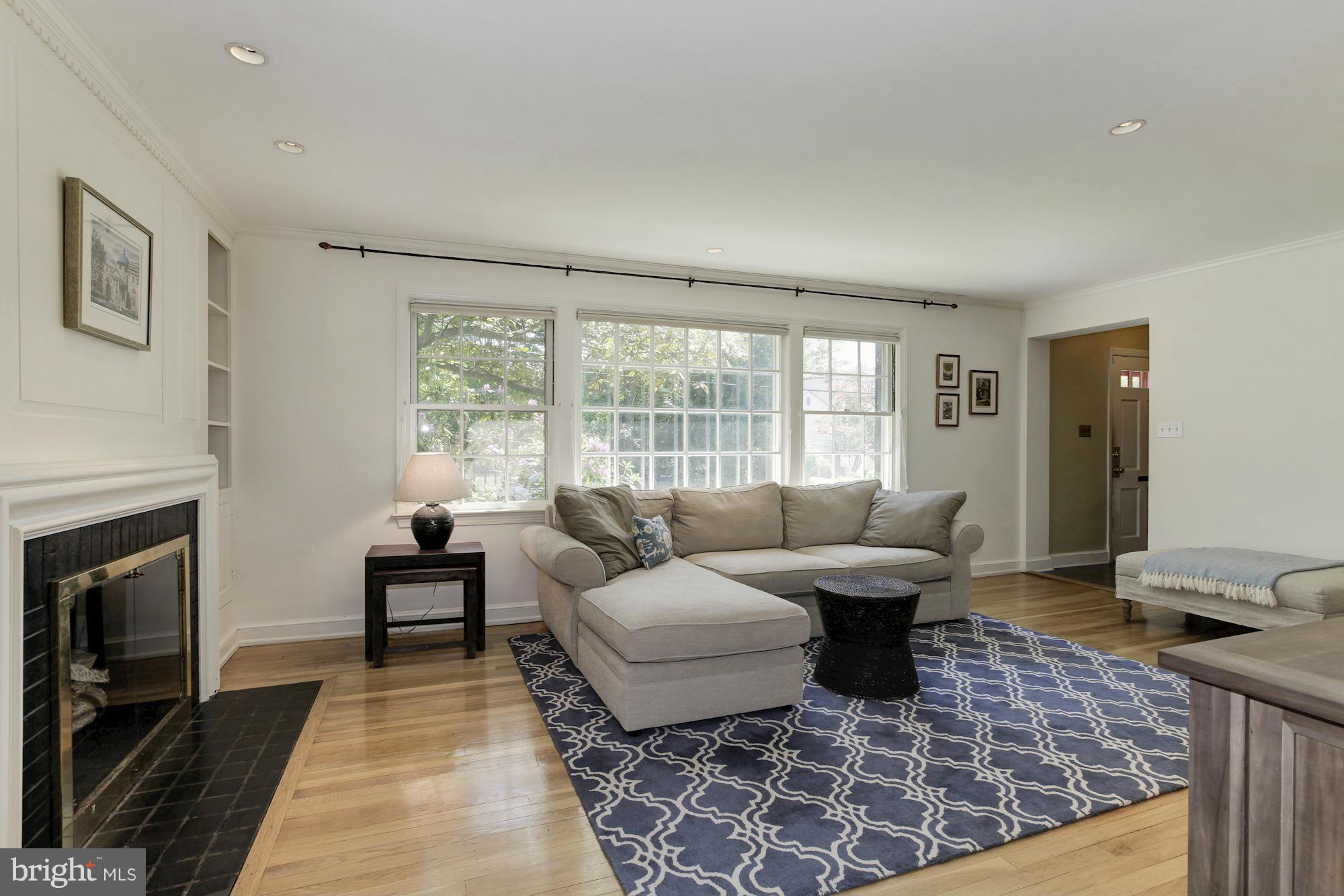 5608 Pollard Road Bethesda, MD 20816 - Photo 3 of 18 a living room with furniture large window and a fireplace