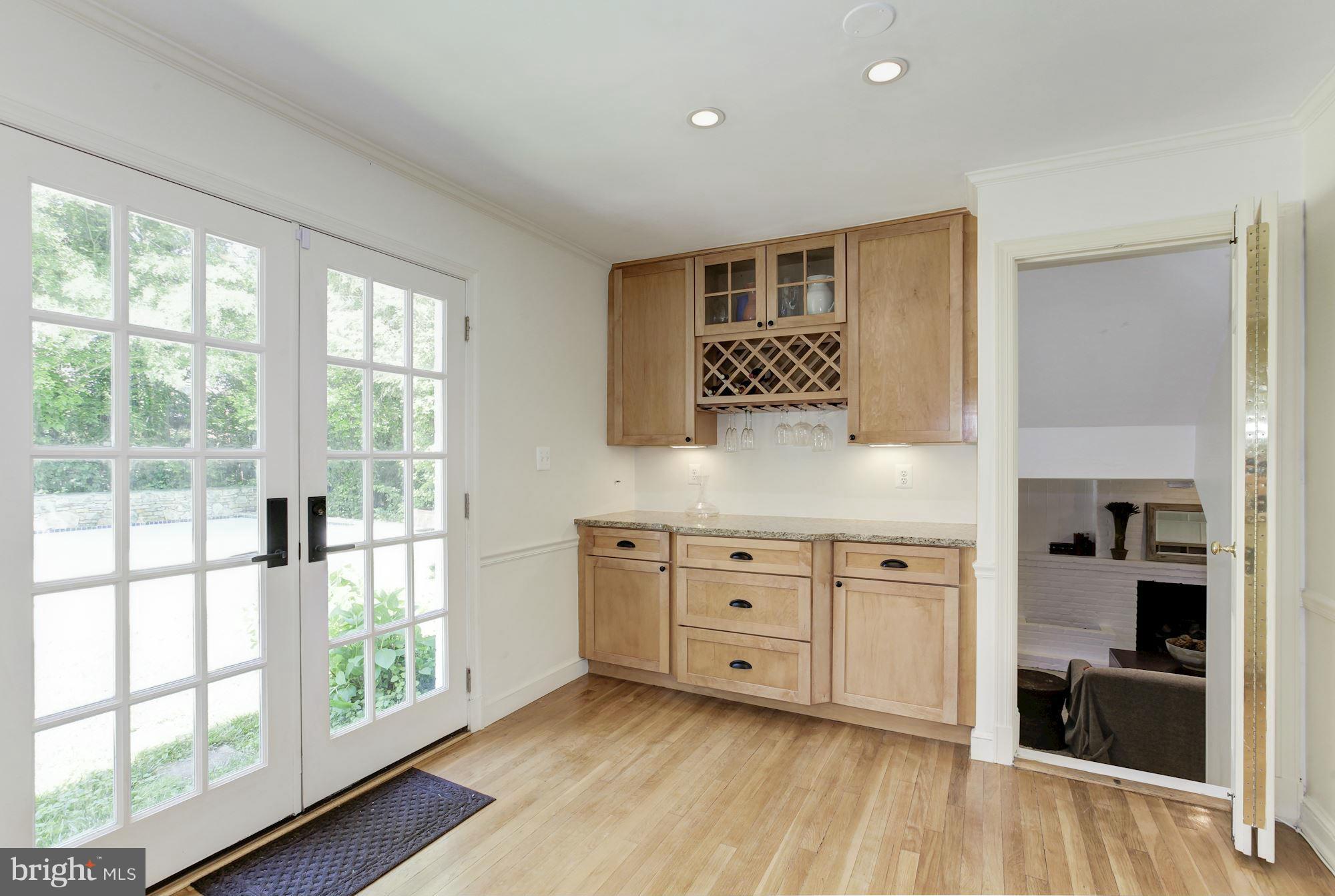 5608 Pollard Road Bethesda, MD 20816 - Photo 8 of 18 a view of wooden floor and windows in a room