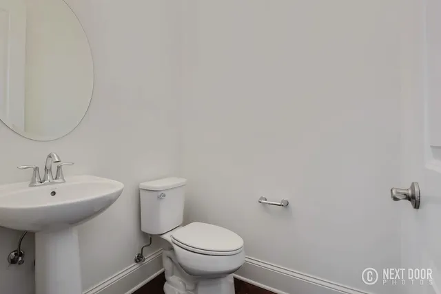 a bathroom with a sink tub and a mirror