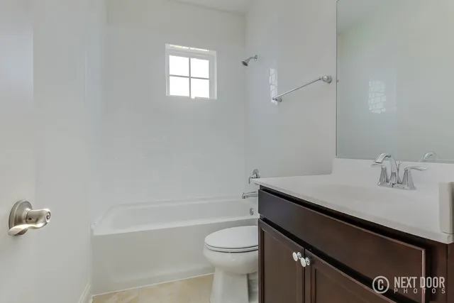 a room with a sink and cabinets