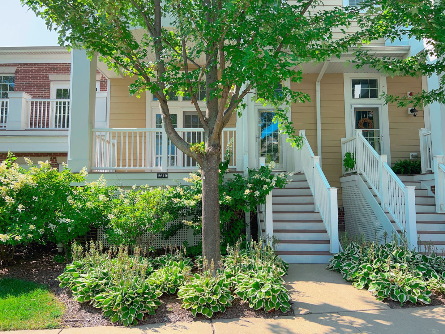 front view of a house with a yard