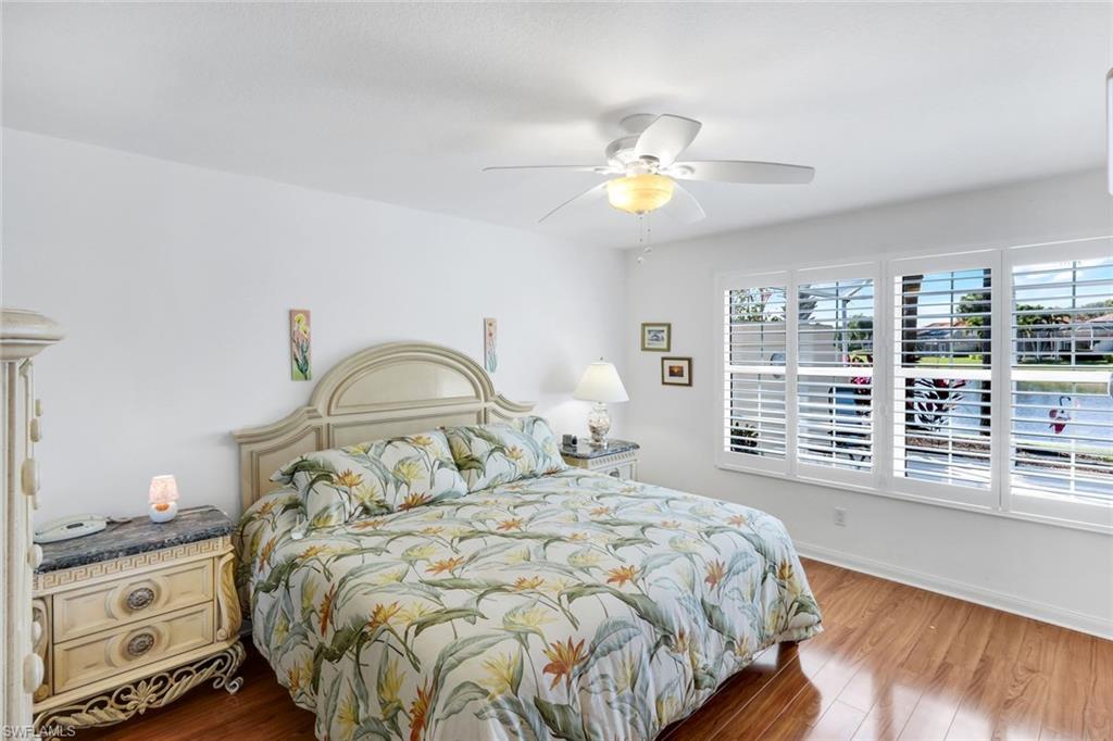 3609 Exuma Way Naples, FL 34119 - Photo 22 of 43 a bedroom with a bed and a window