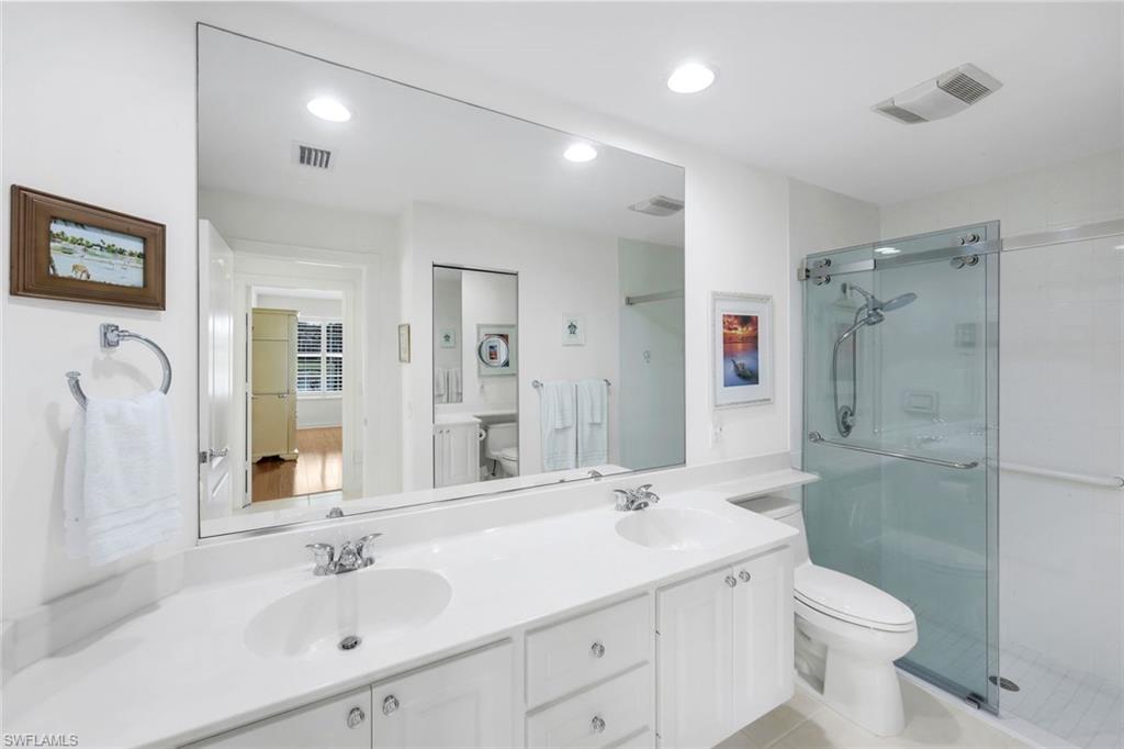 3609 Exuma Way Naples, FL 34119 - Photo 24 of 43 a bathroom with a sink toilet and shower