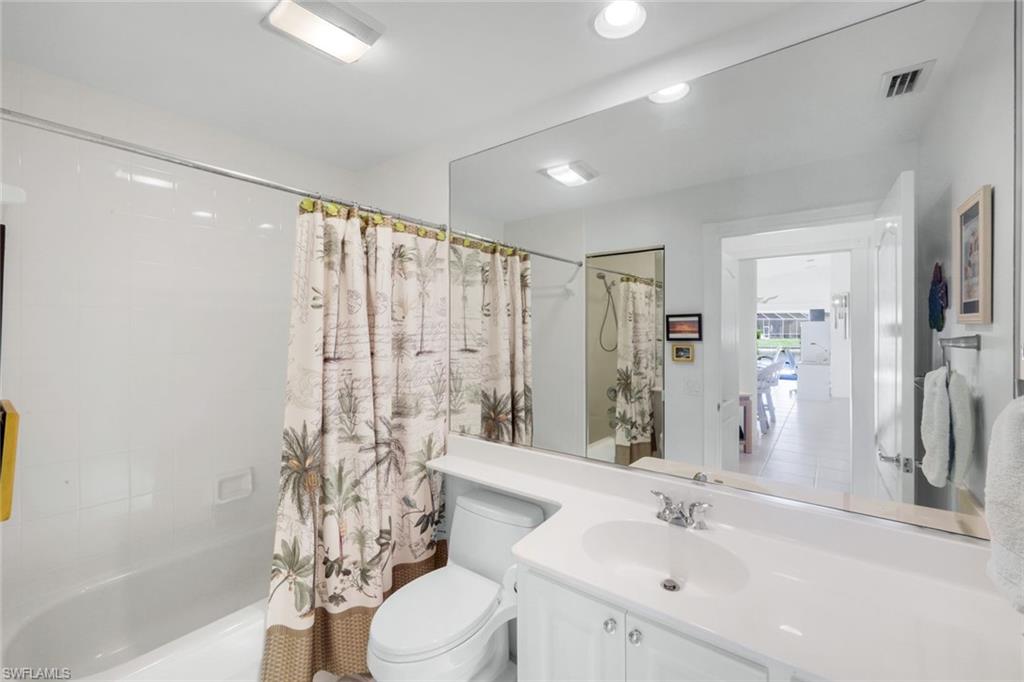 3609 Exuma Way Naples, FL 34119 - Photo 26 of 43 a bathroom with a sink a toilet and shower