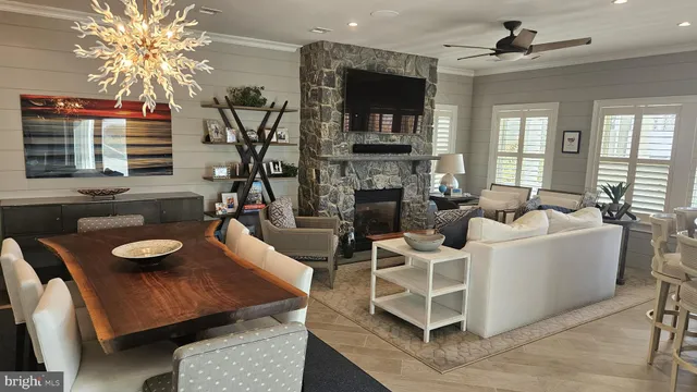 a dining room with chairs and window