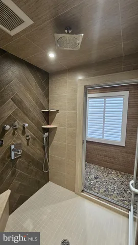 a view of a livingroom with workspace and a window