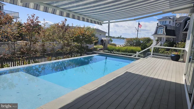 a view of balcony and deck with wooden floor and fence