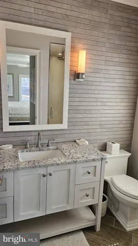 a bathroom with a toilet and a sink
