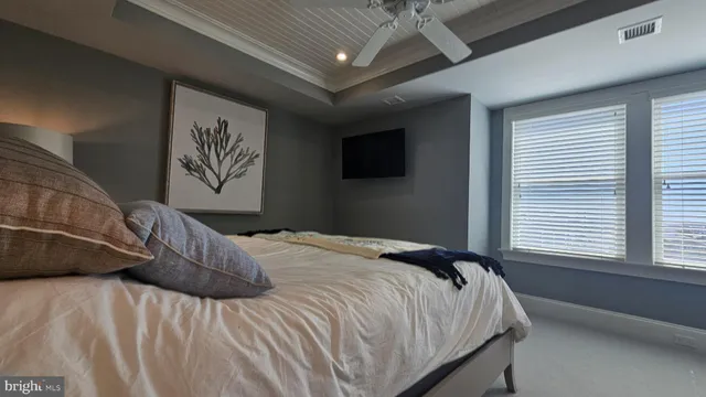 a bathroom with double vanity and a mirror