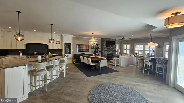 a kitchen with granite countertop a sink stove and cabinets