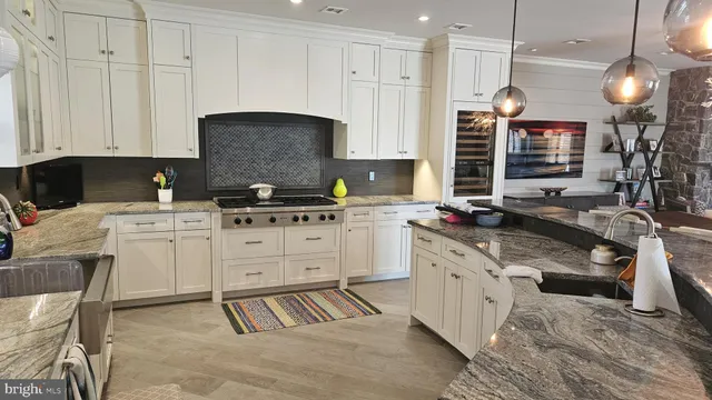 a living room with fireplace furniture and a flat screen tv