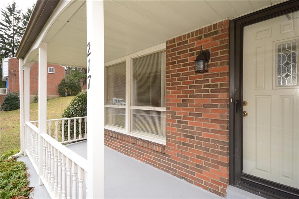 217 Segar Road Pittsburgh, PA 15243 - Photo 2 of 25 Nice front porch with full view storm door and updated front door with glass insert.