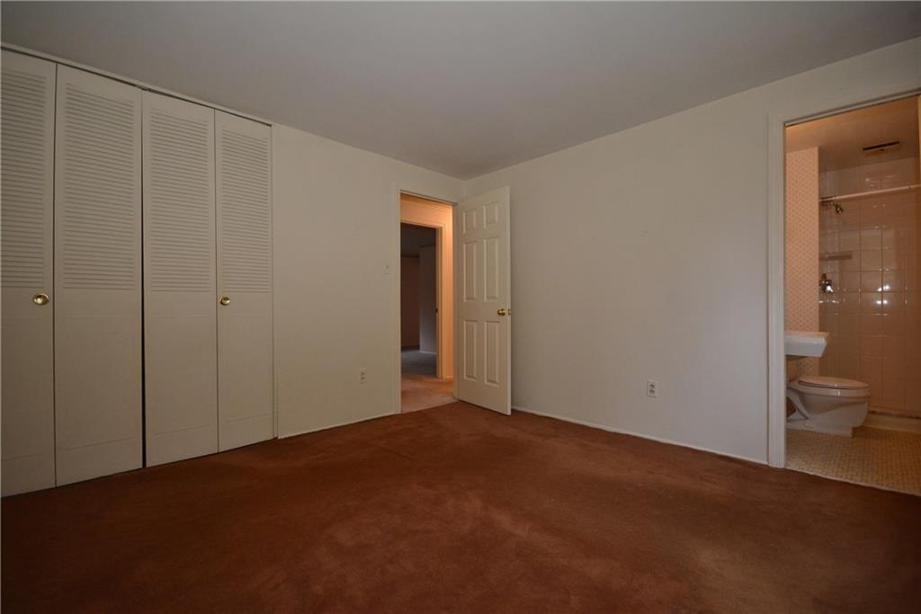 217 Segar Road Pittsburgh, PA 15243 - Photo 13 of 25 Master bedroom with good closet and master bathroom. Carpet covers wood floors.