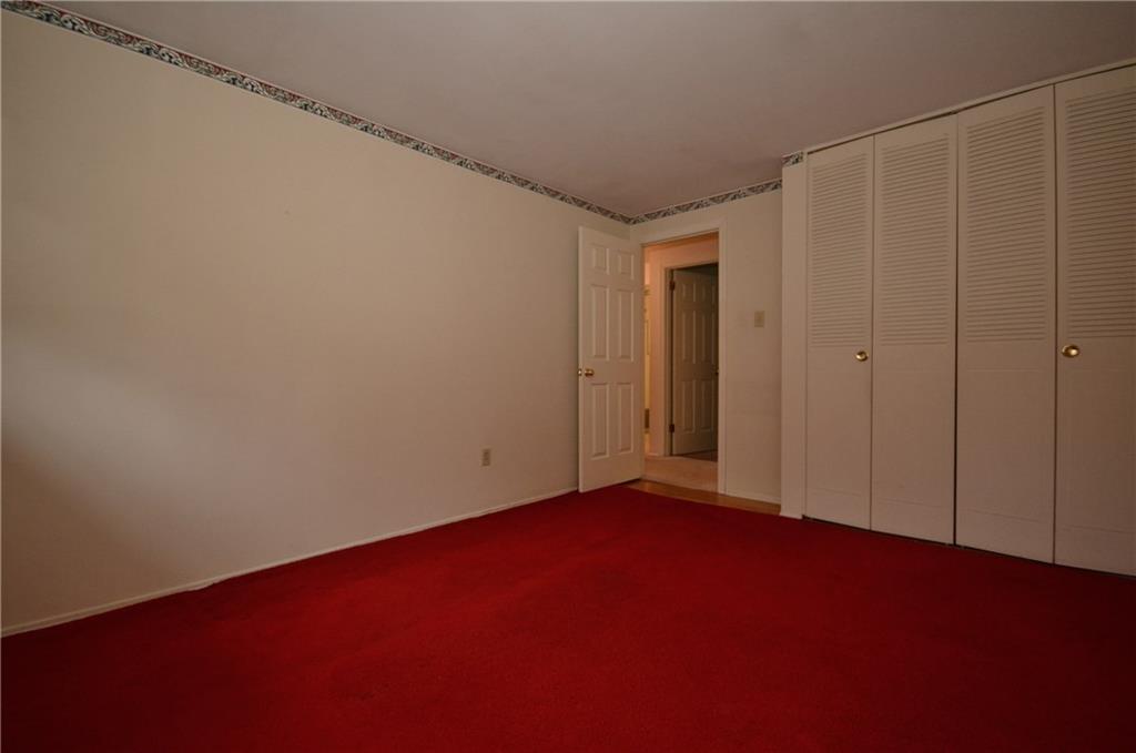 217 Segar Road Pittsburgh, PA 15243 - Photo 16 of 25 Second Bedroom with generous closets. Carpet covers wood floors.
