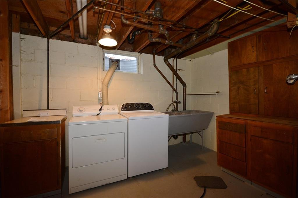 217 Segar Road Pittsburgh, PA 15243 - Photo 22 of 25 Wonderful to have a large laundry room. Good storage stays. Washer and Dryer in working order and can stay with house but in "as is" condition.