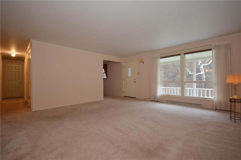 217 Segar Road Pittsburgh, PA 15243 - Photo 4 of 25 Large open space in living room. Wood floors under carpet.
