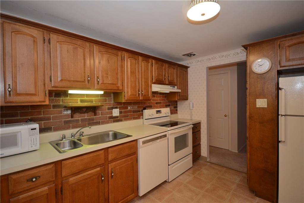 217 Segar Road Pittsburgh, PA 15243 - Photo 9 of 25 Pretty kitchen! Eat in space and door to back patio!