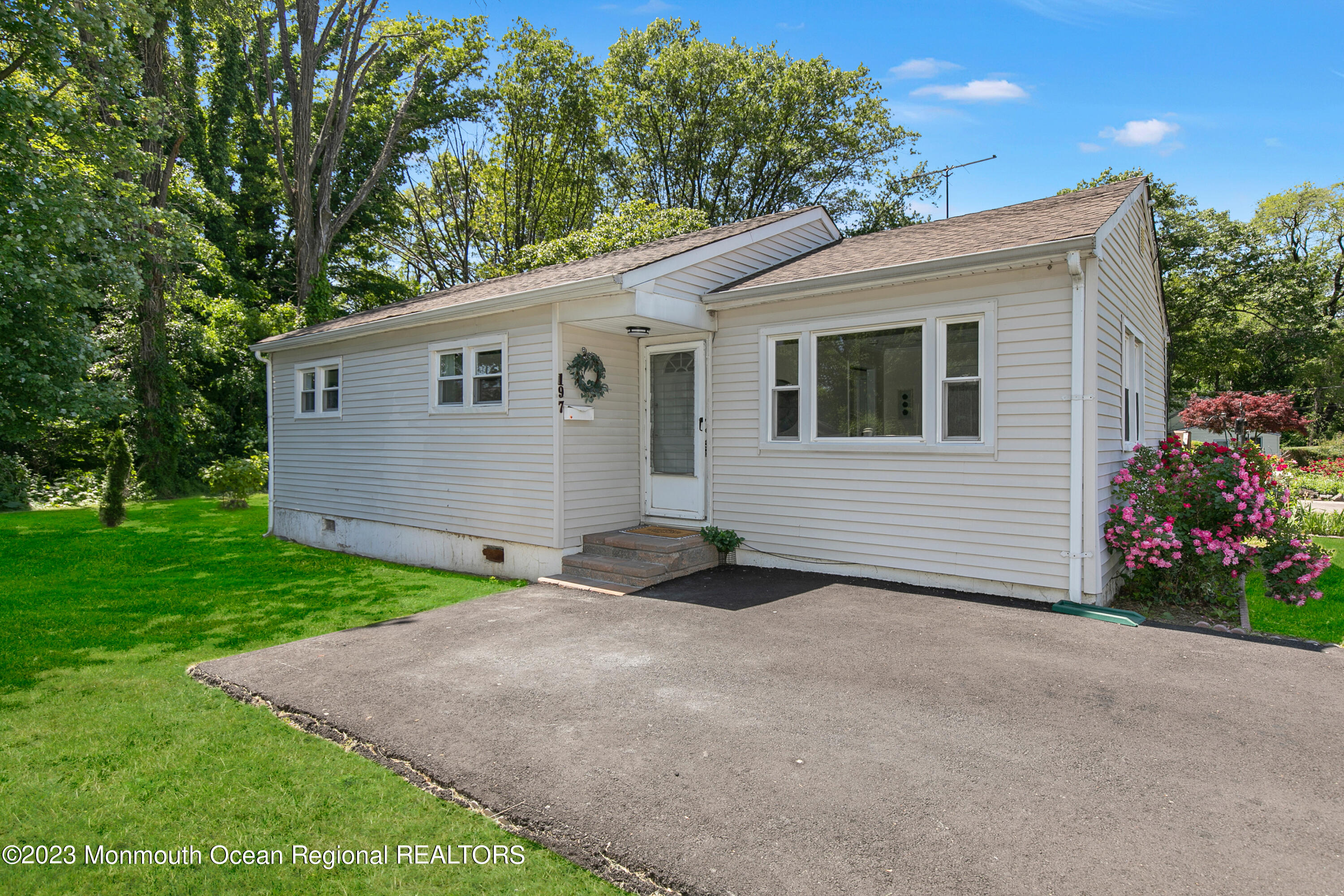 197 Raritan Street Keyport, NJ 07735 - Photo 1 of 28 a backyard of a house with plants and trees