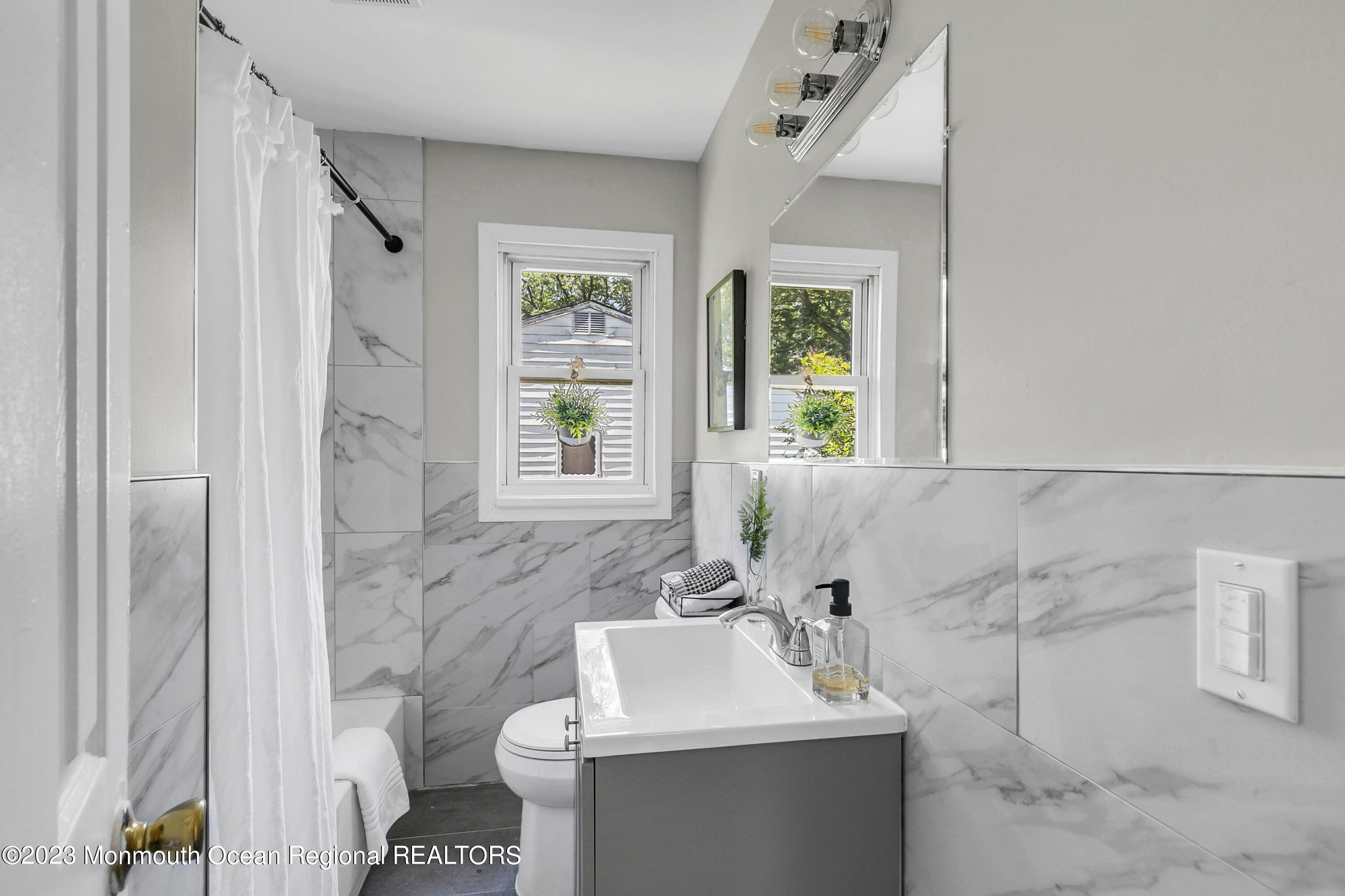 197 Raritan Street Keyport, NJ 07735 - Photo 16 of 28 a bathroom with a sink toilet and shower