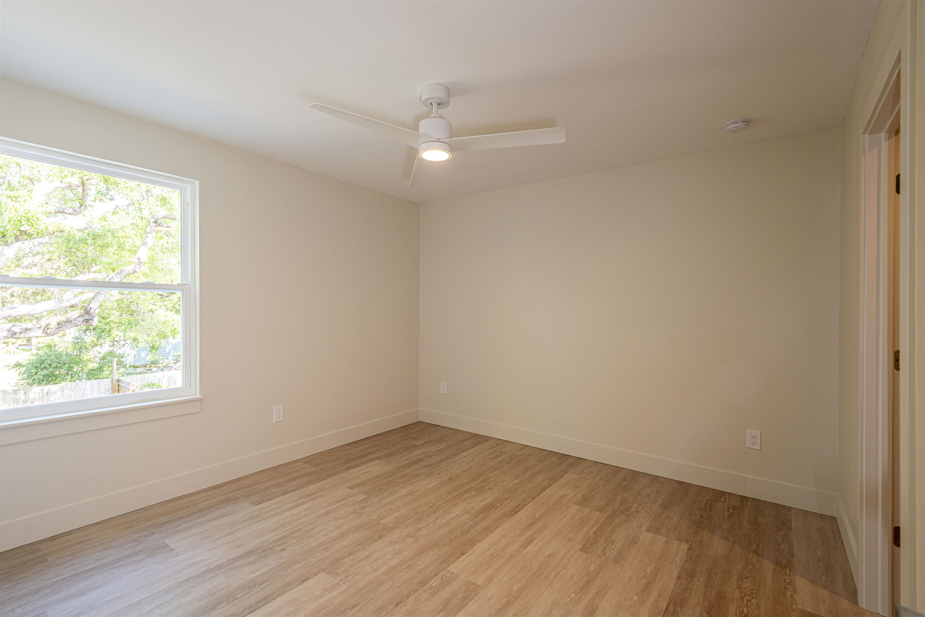 2599 A1A South St. Augustine, FL 32080 - Photo 9 of 17 an empty room with wooden floor and windows