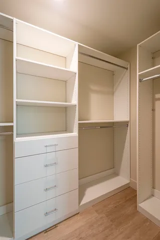 a view of an empty walk in closet
