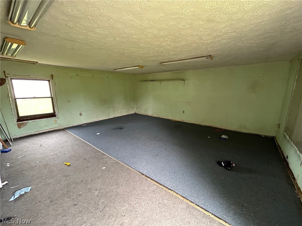 4106 Jaeger Road Lorain, OH 44053 - Photo 8 of 17 Spare room with a textured ceiling