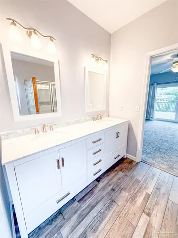a bathroom with a sink and a mirror