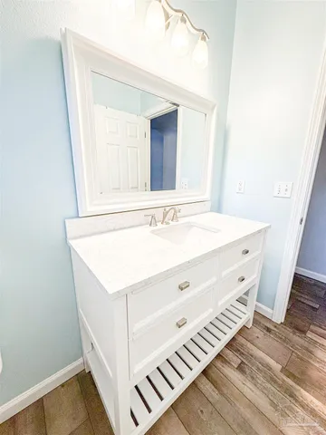 swimming pool view with a seating space