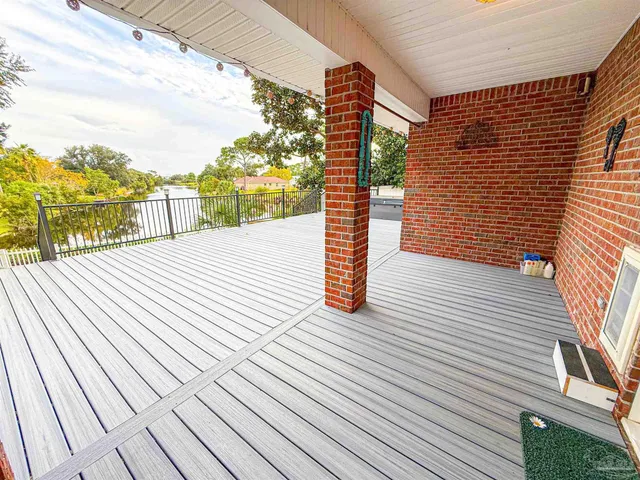 a view of a swimming pool with an outdoor space and seating area