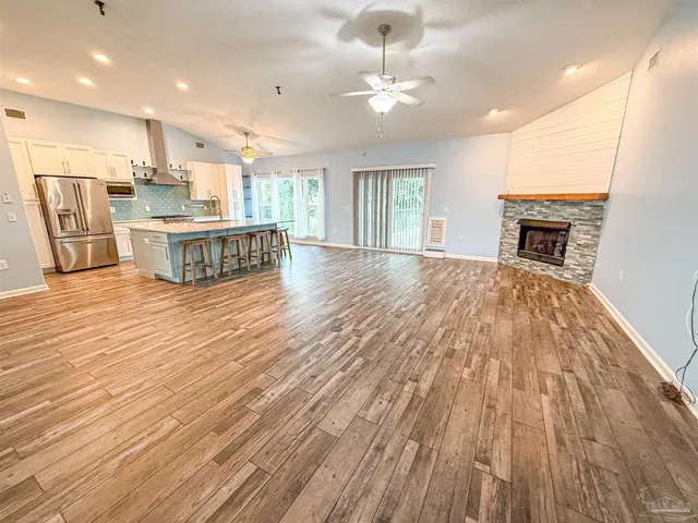 a view of kitchen with cabinets and wooden floor