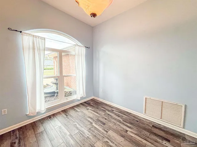 a view of an empty room with a window