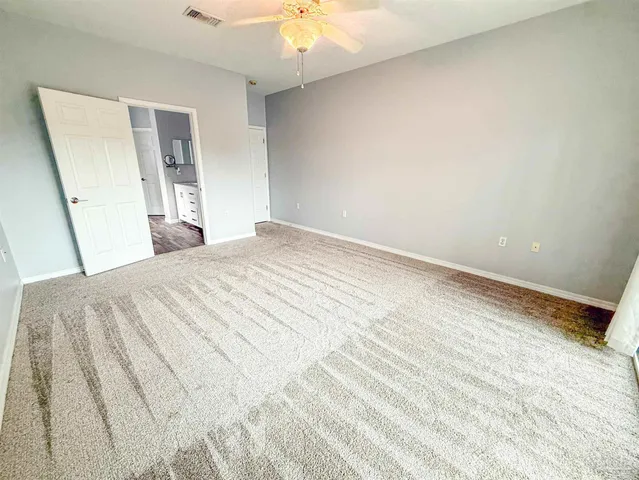 a bathroom with a bathtub a shower and a window