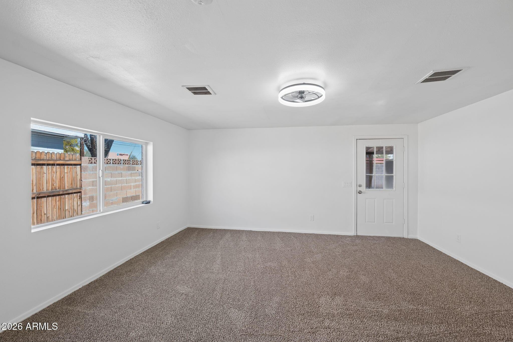 7 South Catalina Street Gilbert, AZ 85233 - Photo 12 of 34 a view of an empty room with a window