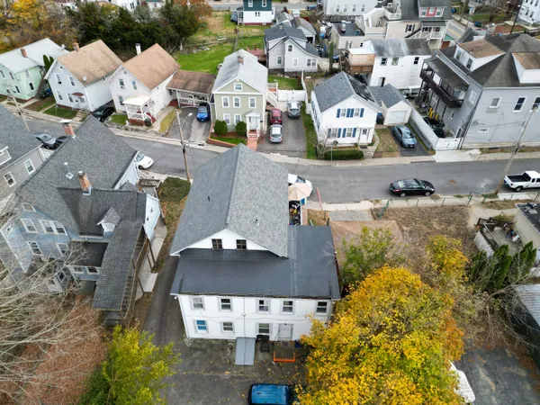 an aerial view of residential houses with outdoor space