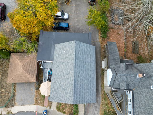 an aerial view of a house with a lake view
