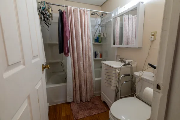 a bathroom with a toilet and a shower
