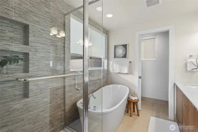 a bathroom with a bathtub and a shower