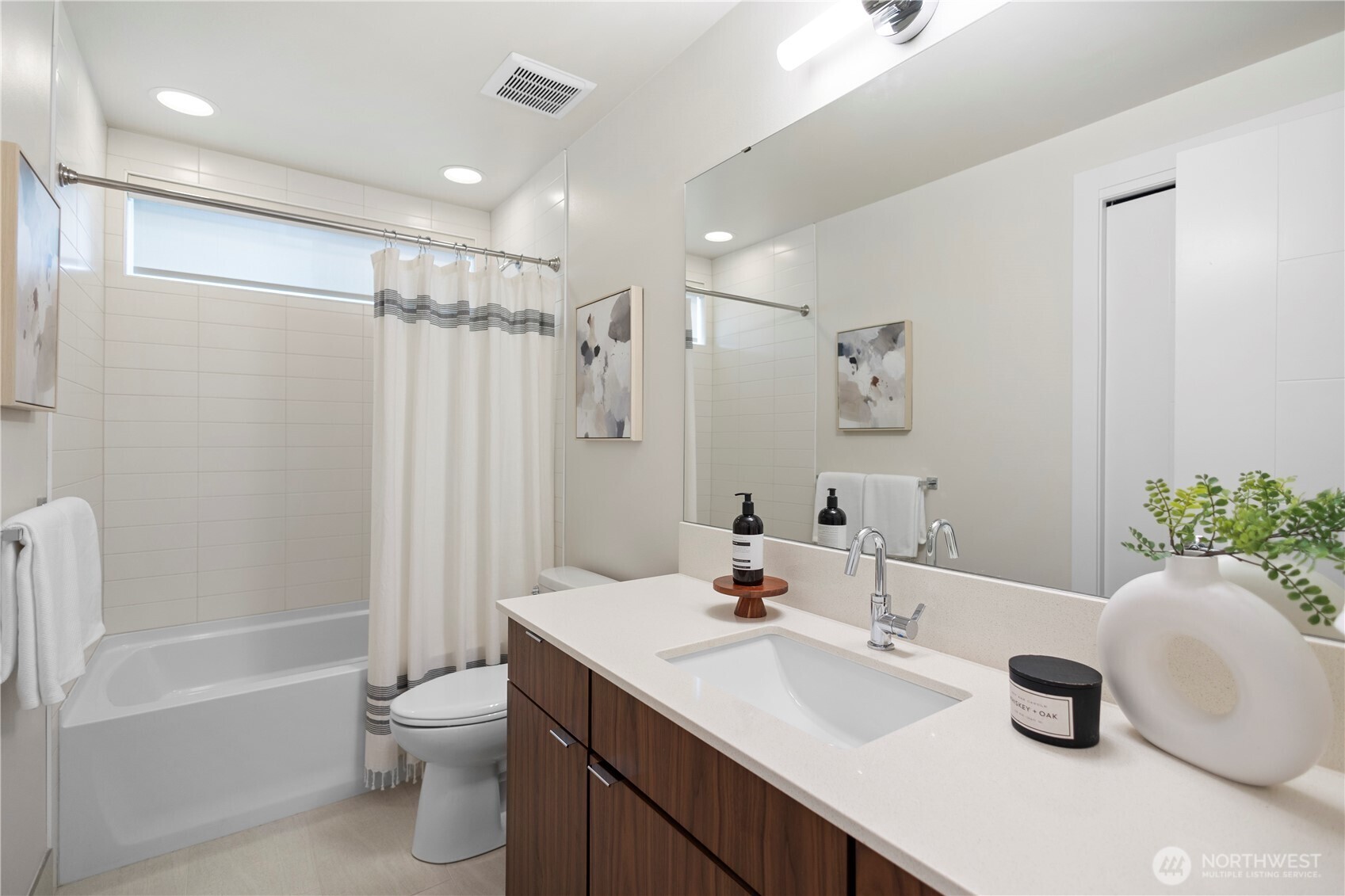 2212 Franklin Avenue East, Unit B Seattle, WA 98102 - Photo 18 of 32 a bathroom with a sink a toilet and shower