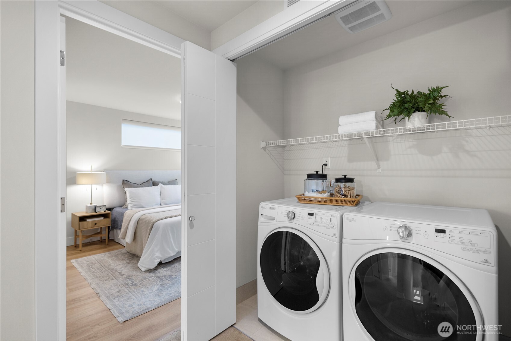 2212 Franklin Avenue East, Unit B Seattle, WA 98102 - Photo 23 of 32 a view of washer and dryer with kitchen in the background