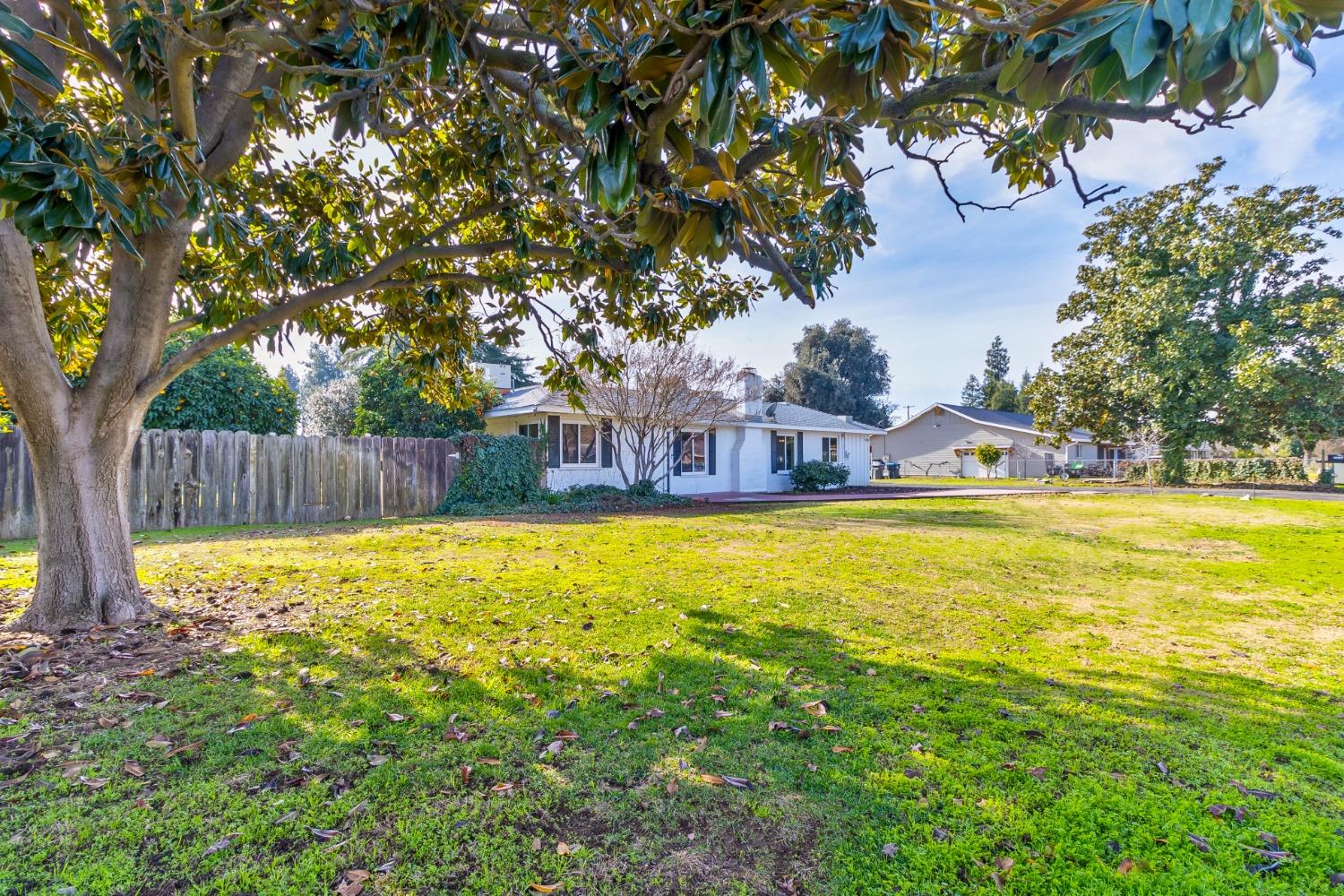 5856 East Park Cir Drive Fresno, CA 93727 - Photo 2 of 47 a swimming pool with outdoor seating and yard
