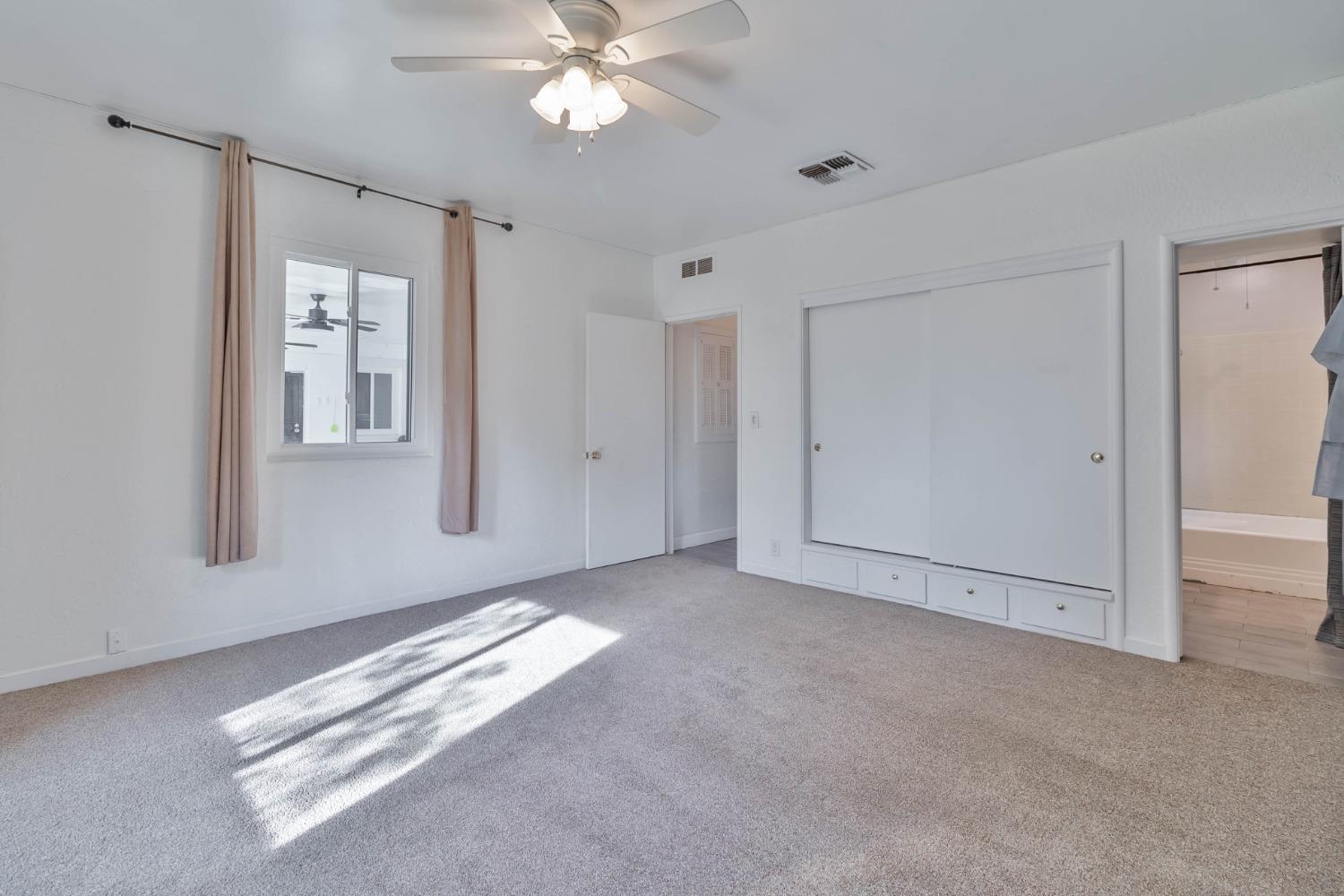 5856 East Park Cir Drive Fresno, CA 93727 - Photo 24 of 47 a view of an empty room with window