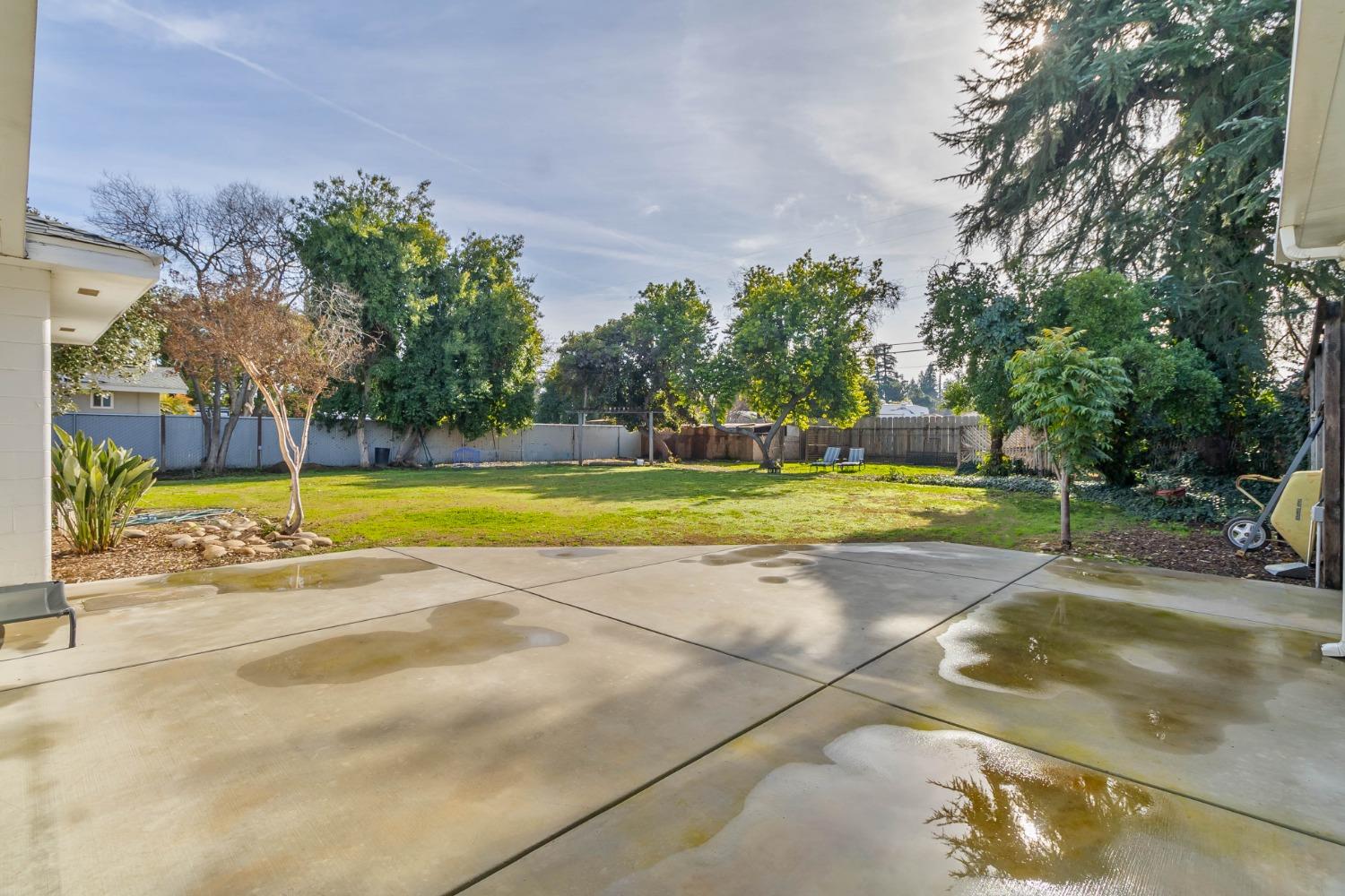 5856 East Park Cir Drive Fresno, CA 93727 - Photo 34 of 47 a view of a swimming pool with an outdoor space and seating area