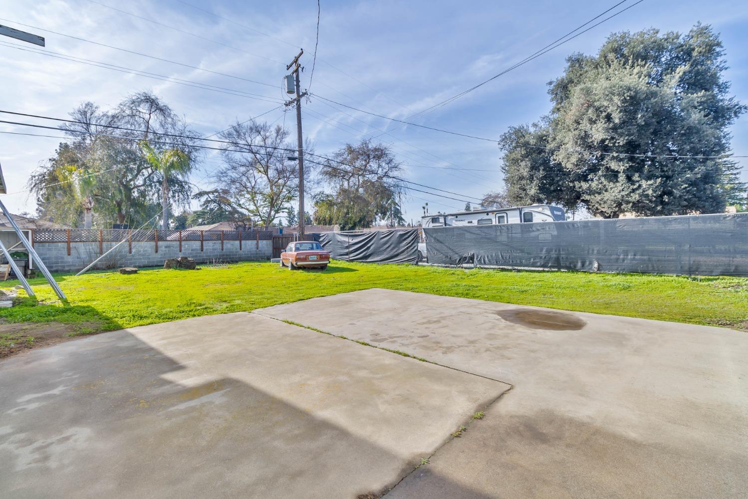 5856 East Park Cir Drive Fresno, CA 93727 - Photo 41 of 47 a view of a swimming pool and a yard