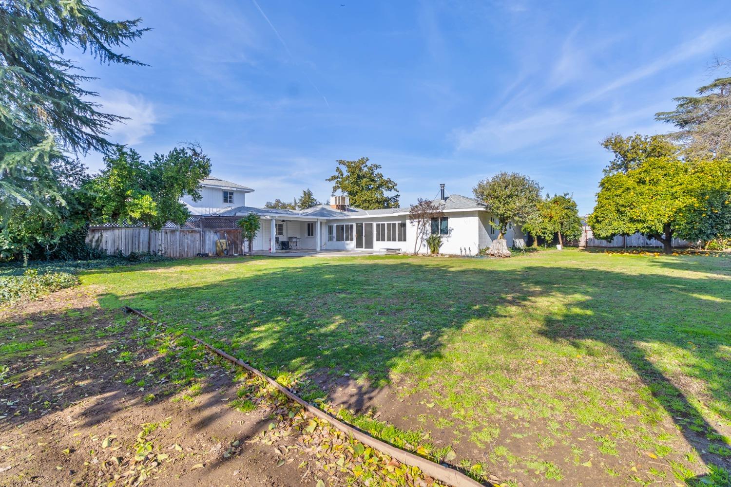5856 East Park Cir Drive Fresno, CA 93727 - Photo 44 of 47 a view of a house with a big yard