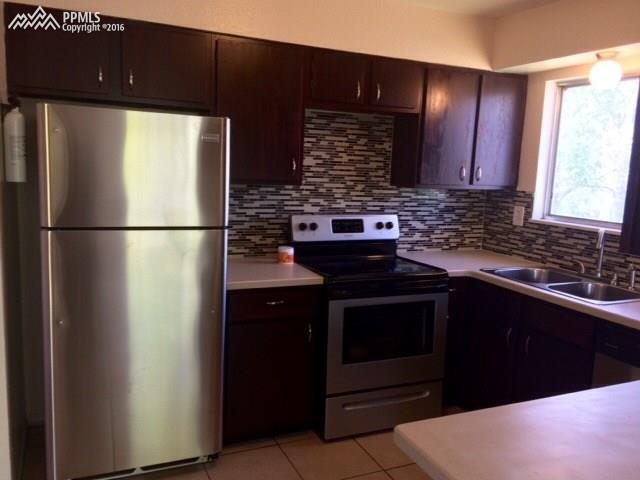4415 Beaumont Road Colorado Springs, CO 80916 - Photo 10 of 29 Beautifully updated kitchen. All appliances stay.