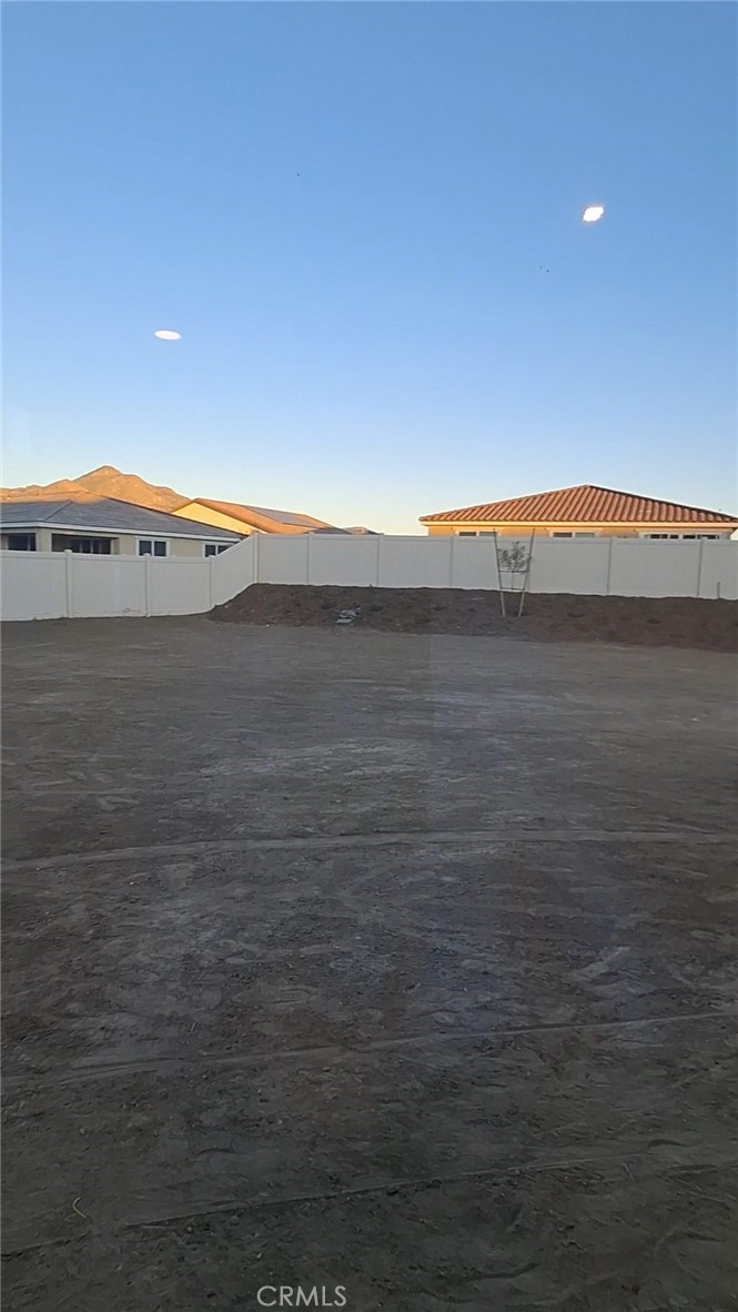 223 Oakton Court Hemet, CA 92543 - Photo 8 of 9 a view of an ocean and a yard