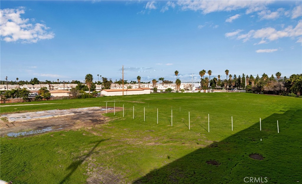 7509 Arlington Riverside, CA 92503 - Photo 1 of 27 a view of a golf course with a lake